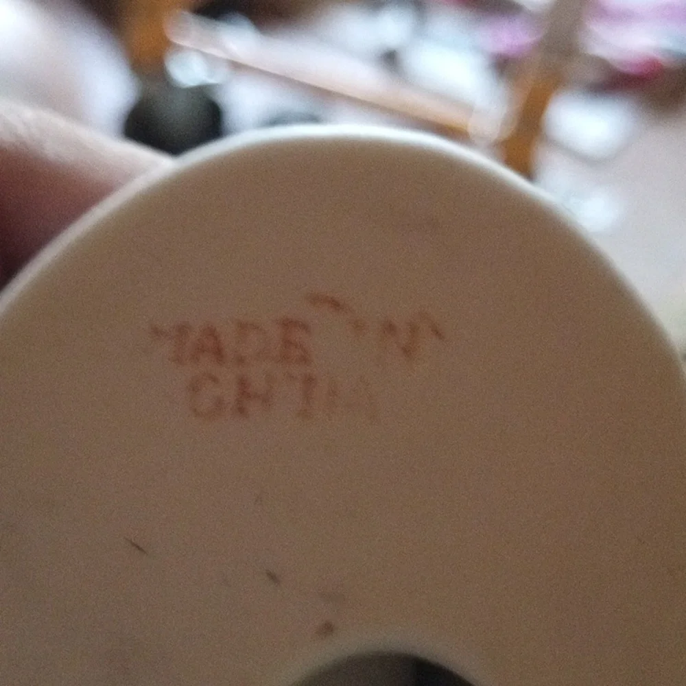 Porcelain Figurine with Floral Base